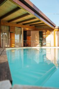 a swimming pool in front of a house at Relax in Vieste