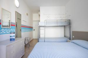 Letto o letti in una camera di MuMA Hostel