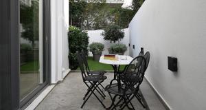 A garden outside The Lop Athens Holidays Luxury Suites