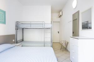 Letto o letti in una camera di MuMA Hostel