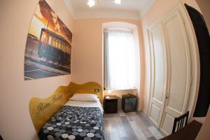 Postel nebo postele na pokoji v ubytování Rooms Boutique Carducci