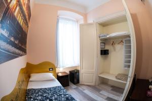 Postel nebo postele na pokoji v ubytování Rooms Boutique Carducci