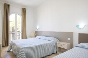 Letto o letti in una camera di MuMA Hostel
