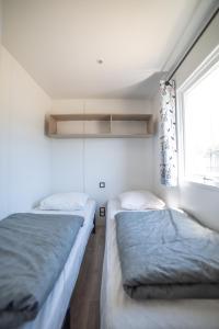 Postel nebo postele na pokoji v ubytování Camping du Sevron