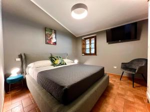 A bed or beds in a room at La Sosta in Toscana Még 37 kép
