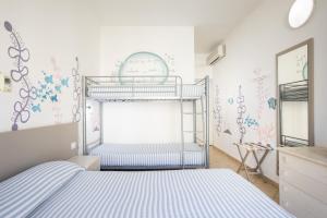 Letto o letti in una camera di MuMA Hostel