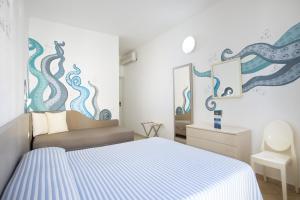 Letto o letti in una camera di MuMA Hostel