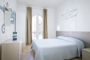 Letto o letti in una camera di MuMA Hostel