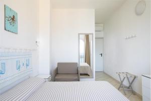 Letto o letti in una camera di MuMA Hostel