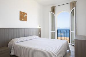 Letto o letti in una camera di MuMA Hostel