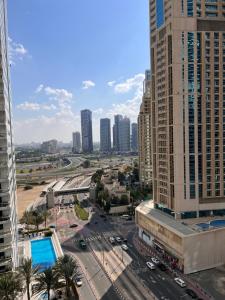 a city view of a city with tall buildings at Two Continents Holiday Homes - In the heart of Dubai Marina -Free Airport Pick-up in Dubai