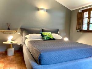 A bed or beds in a room at La Sosta in Toscana