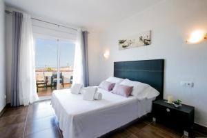 Postel nebo postele na pokoji v ubytování 404 Colina Blanca Vista al Mar y WIFI