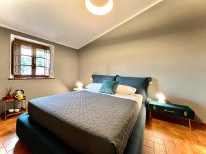 A bed or beds in a room at La Sosta in Toscana