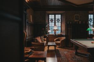 a living room with a pool table in it at Engsholms Slott - Adults Only in Mörkö