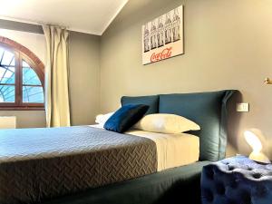 A bed or beds in a room at La Sosta in Toscana