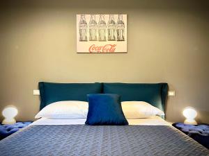 A bed or beds in a room at La Sosta in Toscana