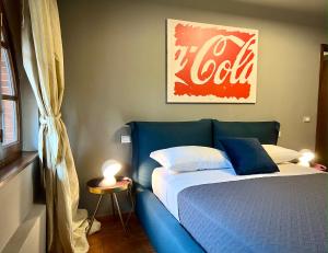 A bed or beds in a room at La Sosta in Toscana