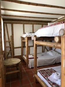 Postel nebo postele na pokoji v ubytování Hotel La Montoya