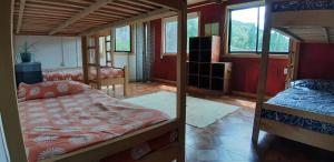 Łóżko lub łóżka w pokoju w obiekcie Hostal Las Natalias
