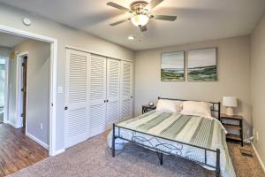 a bedroom with a bed and a ceiling fan at Lovely Iowa City Townhome about 3 Mi to Dtwn! in Iowa City