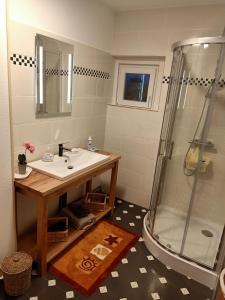 a bathroom with a sink and a shower at Room Algo in Algolsheim
