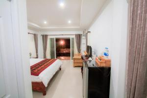 Postel nebo postele na pokoji v ubytování Baan Opun Garden Resort