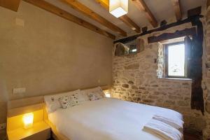 Postel nebo postele na pokoji v ubytování Casa Palacio de Mave