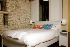 Postel nebo postele na pokoji v ubytování Casa Palacio de Mave