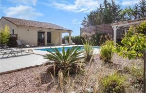 a home with a swimming pool and a house at 3 Bedroom Cozy Home In Caunes Minervois in Caunes-Minervois