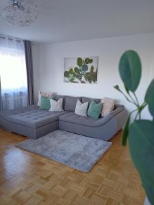 a living room with a couch and a rug at Maja in Füssen