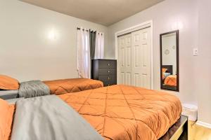 a bedroom with two beds and a mirror at Ideally Located Jersey City Home, 8 Mi to NYC in Jersey City