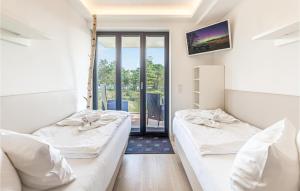 Ein Bett oder Betten in einem Zimmer der Unterkunft Eden