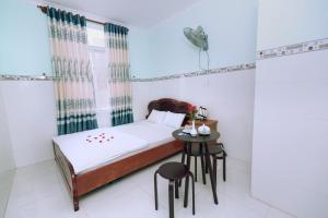 Postel nebo postele na pokoji v ubytování Sevensea Vung Tau