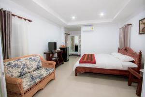 Postel nebo postele na pokoji v ubytování Baan Opun Garden Resort + 32 fotografií