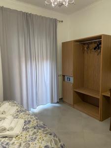 A bed or beds in a room at Donna Felì