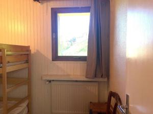 Postel nebo postele na pokoji v ubytování La Bartavelle - Petit duplex avec balcon à proximité des pistes