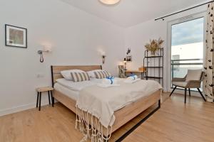Łóżko lub łóżka w pokoju w obiekcie BlueApart Apartamenty Hotelowe Nexo II