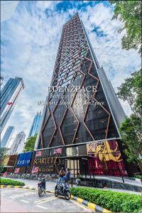 two motorcycles parked in front of a building at Scarletz Suites by Edenzpace @ KLCC Area in Kuala Lumpur