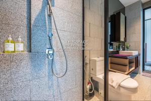 a bathroom with a shower and a toilet at Scarletz Suites by Edenzpace @ KLCC Area in Kuala Lumpur