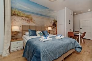 Łóżko lub łóżka w pokoju w obiekcie BlueApart Apartamenty Hotelowe Nexo II