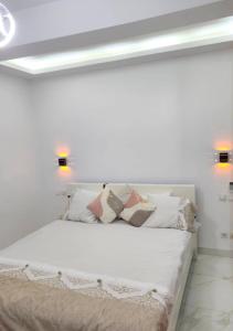 Ένα ή περισσότερα κρεβάτια σε δωμάτιο στο Residence Khadija