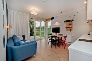 Telewizja i/lub zestaw kina domowego w obiekcie BlueApart Apartamenty Hotelowe Nexo II