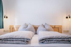 Łóżko lub łóżka w pokoju w obiekcie Appartement Adamhof Spielberg Leogang
