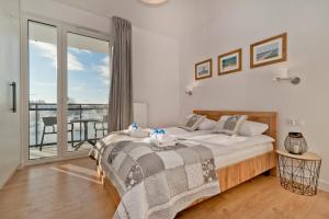 Łóżko lub łóżka w pokoju w obiekcie BlueApart Apartamenty Hotelowe Nexo II