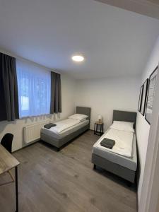 a room with two beds and a window at Petrico Camp Resort in Krzywopłoty