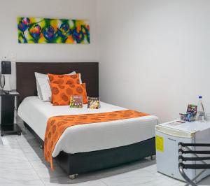 Postel nebo postele na pokoji v ubytování Hotel Montes De La Castellana