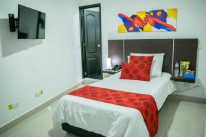 Postel nebo postele na pokoji v ubytování Hotel Montes De La Castellana