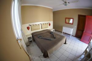 Postel nebo postele na pokoji v ubytování Estoril Hotel - Apartments