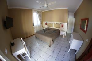 Postel nebo postele na pokoji v ubytování Estoril Hotel - Apartments
